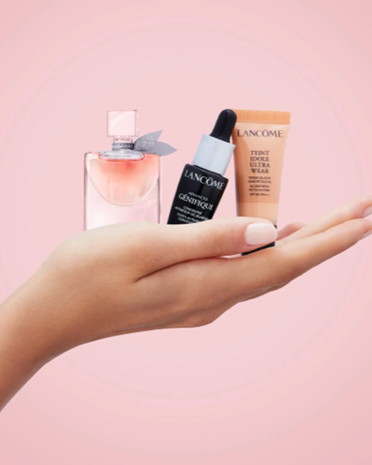 Lancôme skincare and makeup minis displayed together in a hand