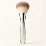 AI-generated illustration of La Mer The Powder Brush; actual packaging may differ.